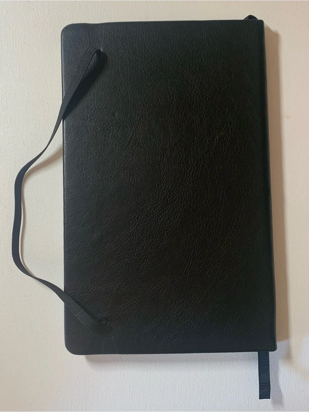 Black leather notebook with elastic band closure
